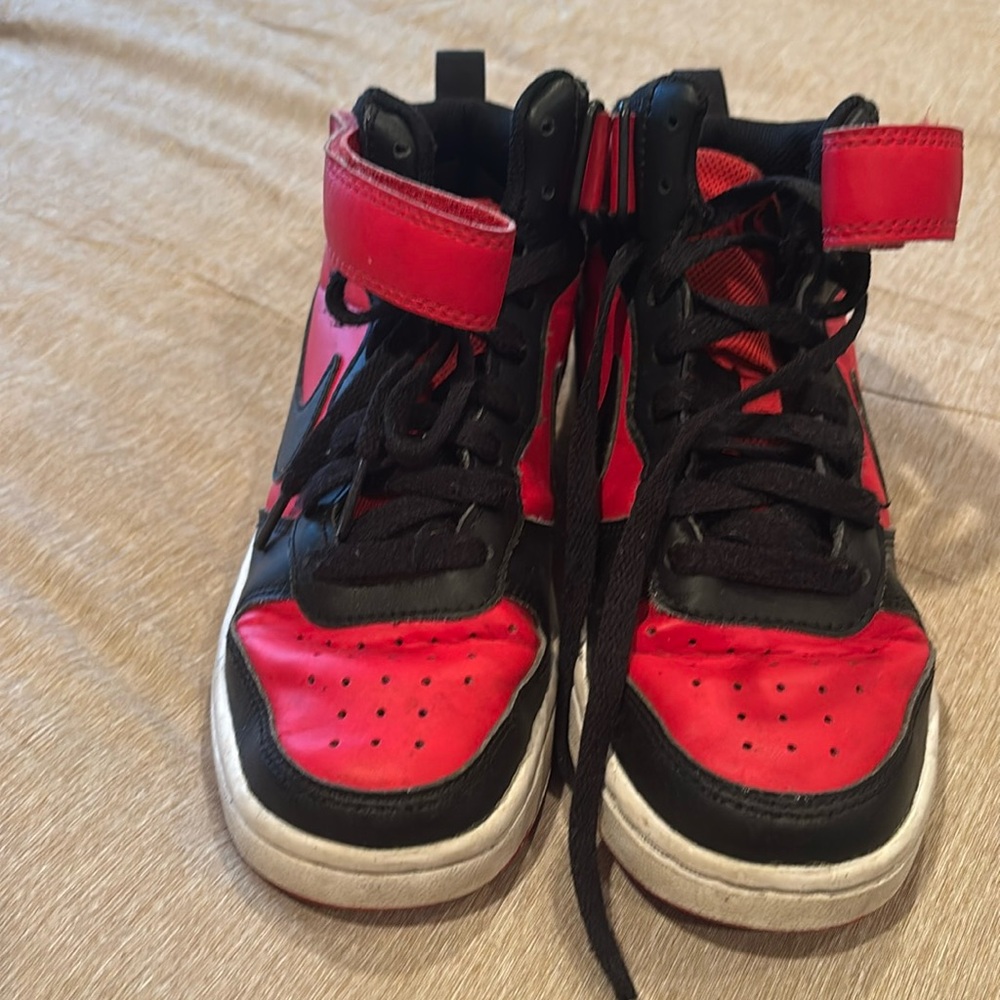 Boys four youth Nike high top sneakers worn but still have a lot of life